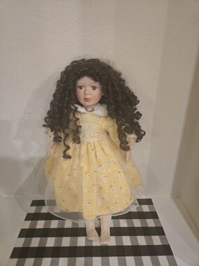 Curly-Haired Porcelain Doll in Yellow Floral Dress